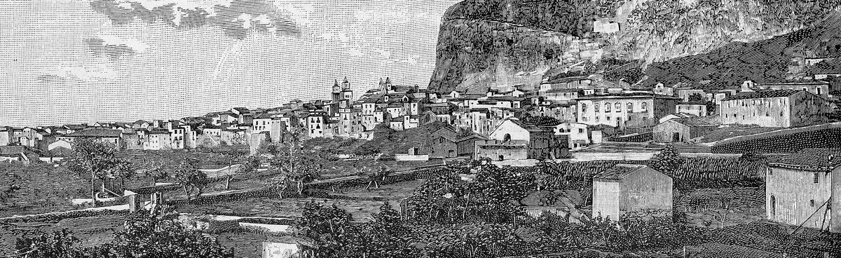Cefalù from the sea — the old town beneath La Rocca